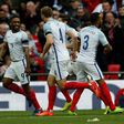 England's striker Jermain Defoe (L) celebrates with teammates after scoring against Lithuania at Wembley Stadium in London on March 26, 2017