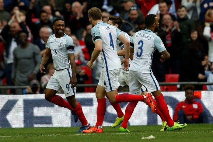 England's striker Jermain Defoe (L) celebrates with teammates after scoring against Lithuania at Wembley Stadium in London on March 26, 2017