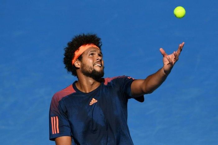 France's Jo-Wilfried Tsonga serves against Switzerland's Stan Wawrinka during their quarter-final at the Australian Open on January 24, 2017