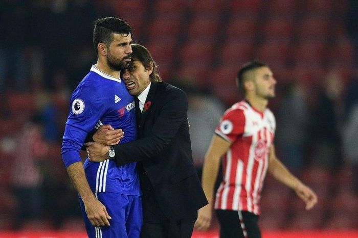 Chelsea's manager Antonio Conte embraces striker Diego Costa after their English Premier League match against Southampton, at St Mary's Stadium in Southampton, on October 30, 2016