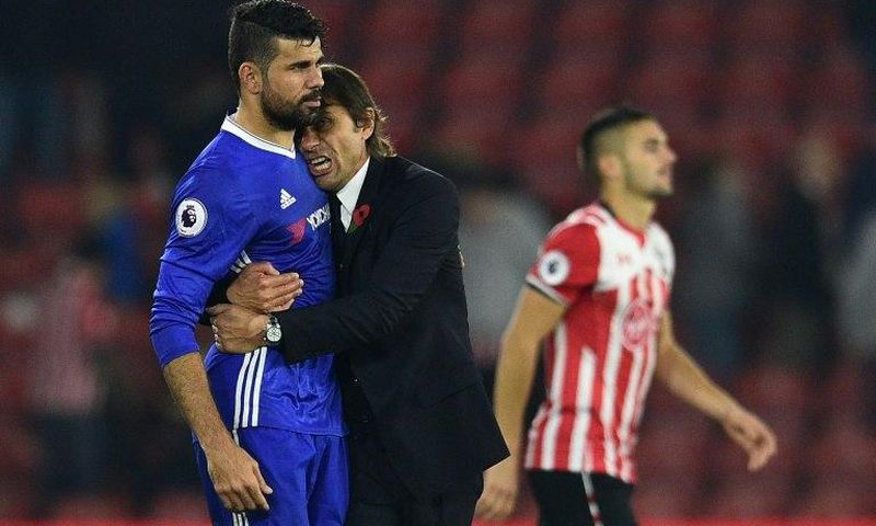 Chelsea's manager Antonio Conte embraces striker Diego Costa after their English Premier League match against Southampton, at St Mary's Stadium in Southampton, on October 30, 2016