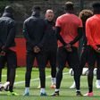 Manchester United players observe a minute's silence for the victims of yesterday's terror attack at the Manchester Arena, during a training session at the club's training complex near Carrington, on May 23, 2017