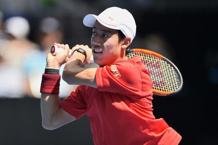Kei Nishikori of Japan hits a return against Jeremy Chardy of France during their Australian Open second round match, in Melbourne, on January 18, 2017