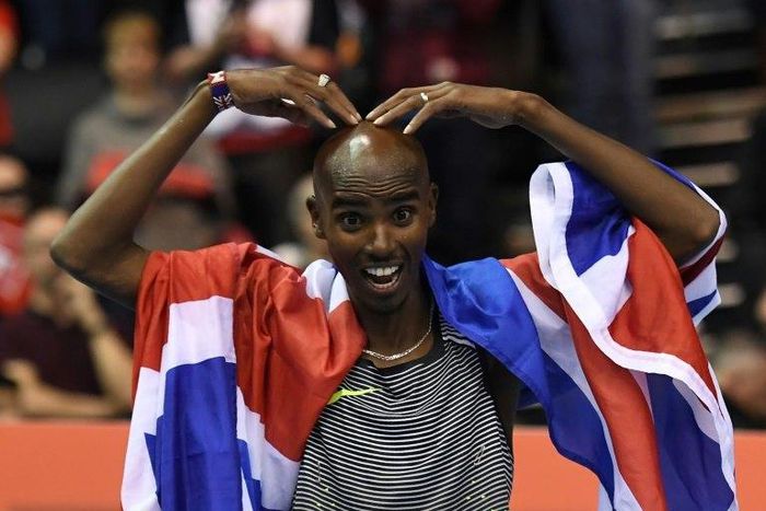 Britain's Mo Farah celebrates after winning the 5000m final during an indoor event in Birmingham, on February 18, 2017