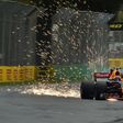 Sparks fly from beneath the car as Red Bull's Australian driver Daniel Ricciardo takes part in the qualifying session for the Formula One Australian Grand Prix in Melbourne on March 25, 2017