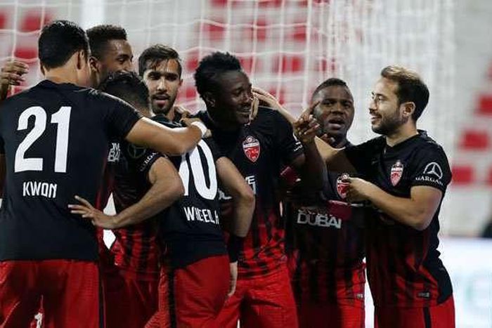 Asamoah Gyan and his teammates