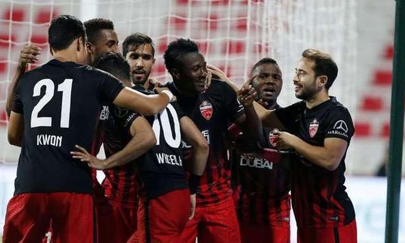 Asamoah Gyan and his teammates