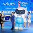Vivo Senior Vice President Ni Xudong and FIFA Secretary General Fatma Samouraon hold a framed football jersey during an event on Beijing on May 31, 2017, to announce Vivo's sponsorship of the FIFA Football World Cup