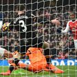 Arsenal striker Alexis Sanchez (L) scores the opening goal of his side's English Premier League match against Hull City at the Emirates Stadium in London on February 11, 2017