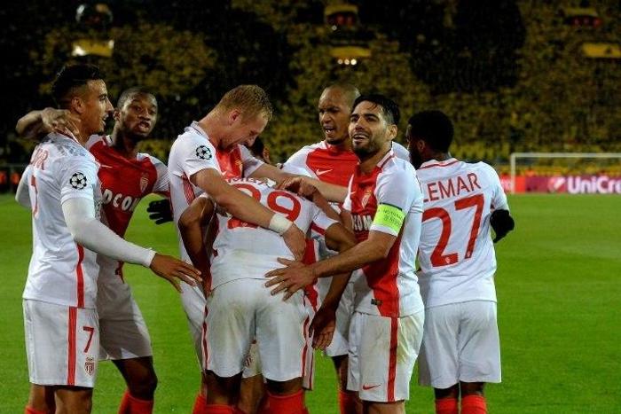 Monaco's players celebrate scoring during their UEFA Champions League 1st leg quarter-final football match against Dortmund, western Germany on April 12, 2017