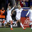 Ellen White of England (R) celebrates her goal with teammates Jordan Nobbs (L) and Steph Houghton against the US during the SheBelieves Cup in New Jersey