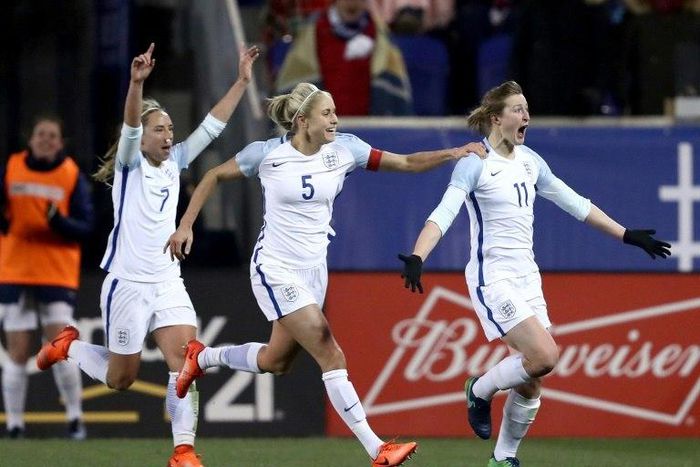 Ellen White of England (R) celebrates her goal with teammates Jordan Nobbs (L) and Steph Houghton against the US during the SheBelieves Cup in New Jersey