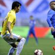 Shanghai Shenhua's Argentine striker Carlos Tevez (R) is in hot water after being spotted at Disneyland after missing a game with his Chinese club