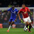 Manchester United's striker Anthony Martial (R) takes on Chelsea's midfielder Victor Moses (L) during the English Premier League football match October 23, 2016