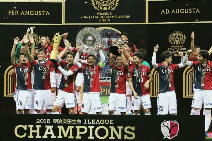 Kashima Antlers players celebrate their victory over Urawa Reds after the J-League Championship final in Saitama, on December 3, 2016