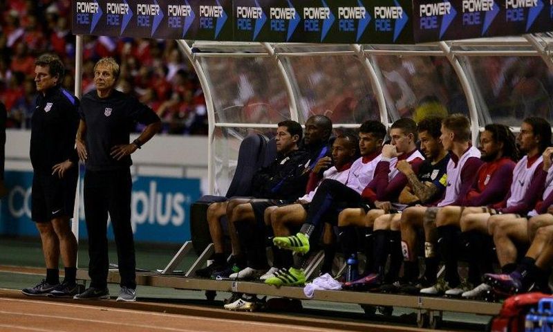 United States' players on the bench react during their 2018 FIFA World Cup qualifier football match against Costa Rica on November 15, 2016