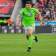 Wolfsburg's forward Mario Gomez runs with the ball against Bayer Leverkusen on April 2, 2017