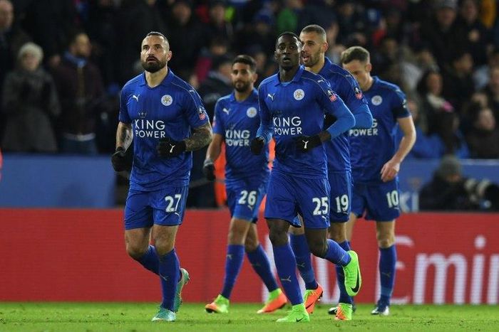 Leicester City's midfielder Wilfred Ndidi (3R) returns with teammates for the restart after scoring their seond goal during the English FA Cup fourth round replay football match between against Derby County February 8, 2017