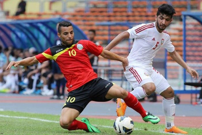 Rodrigo Sousa of East Timor (L) and Amer Abdulrahman of UAE (R) fight for the ball during the 2018 FIFA World Cup qualifier at Shah Alam Stadium in Shah Alam, outside Kuala Lumpur on June 16, 2015