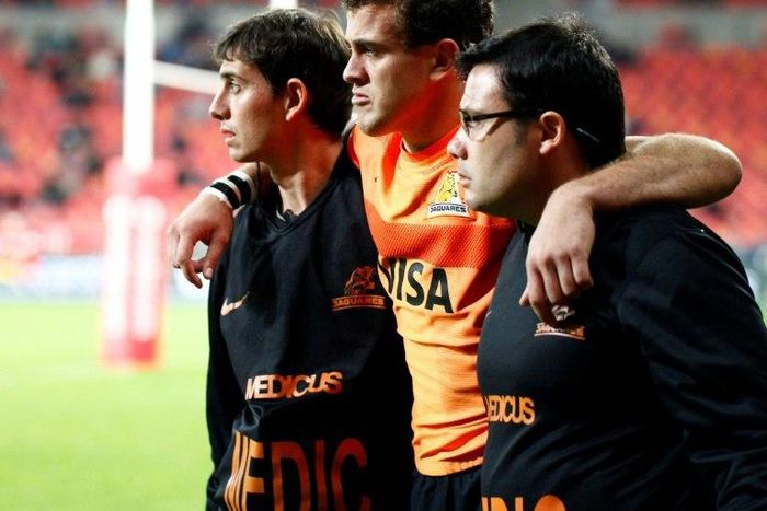 Emiliano Boffelli (C) is helped off the field in 2016 in Port Elizabeth