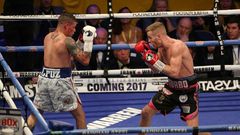 Britain's Terry Flanagan (L) measures Puerto Rico's Orlando Cruz (L) during their World Boxing Organisation lightweight title bout held at the Motorpoint Arena, November 26, 2016