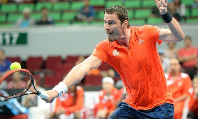 Russia's Marat Safin of the Japan Warriors hits a return against Spain's Carlos Moya of the Singapore Slammers during their men's singles match at the International Premier Tennis League in Manila on December 6, 2015