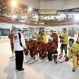 Indonesian ice hockey team players listen to their Malaysian coach Gary Tan (L in white) at a skating rink in South Tangerang, ahead of the Asian Winter Games in Sapporo