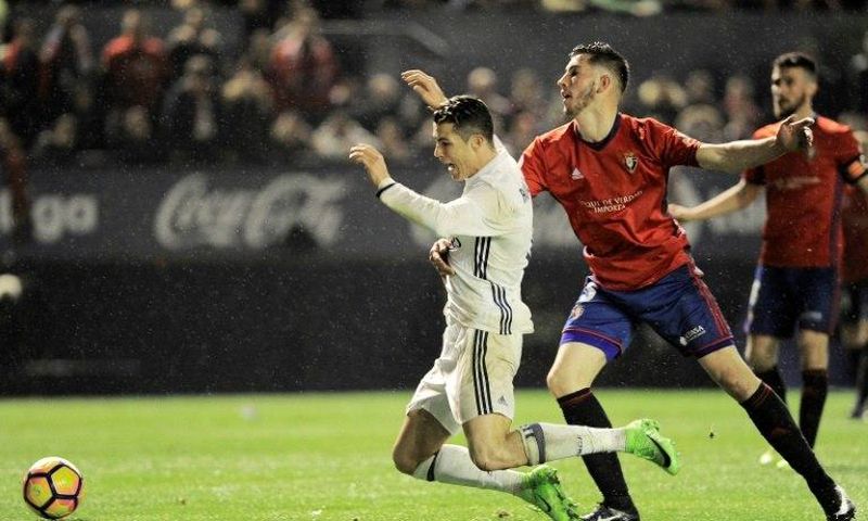 Cristiano Ronaldo (left) suffered a heavy tackle against Osasuna at the weekend