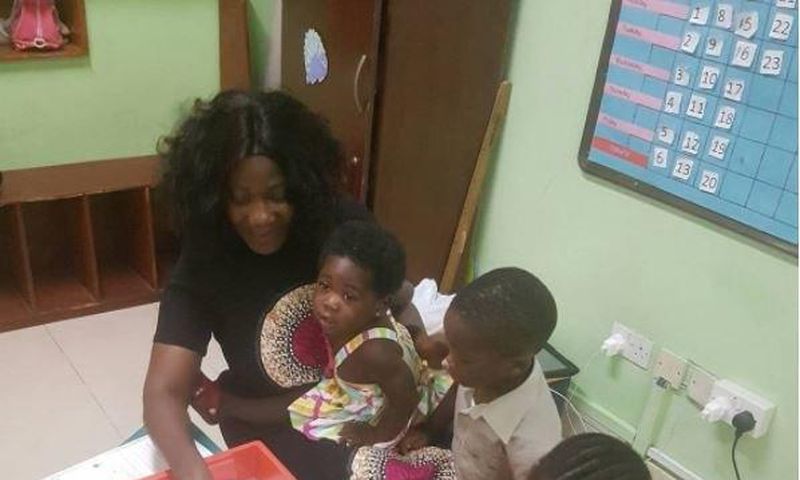 Mercy Johnson at her children's school