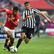 Bayern Munich's Kingsley Coman (L) and Frankfurt's Aymen Barkok vie for the ball during their match in Munich, southern Germany, on March 11, 2017