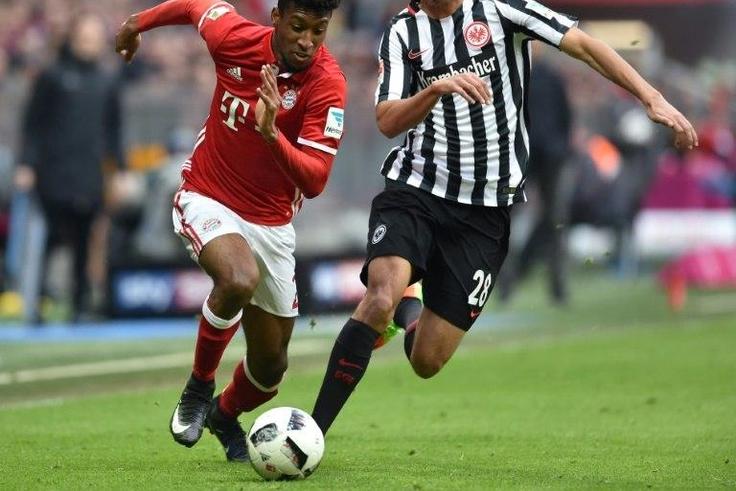 Bayern Munich's Kingsley Coman (L) and Frankfurt's Aymen Barkok vie for the ball during their match in Munich, southern Germany, on March 11, 2017