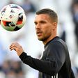 Germany forward Lukas Podolski warms up before the Euro 2016 quarter-final football match against Italy in Bordeaux