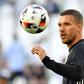 Germany forward Lukas Podolski warms up before the Euro 2016 quarter-final football match against Italy in Bordeaux