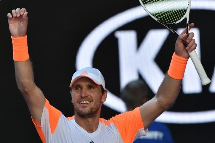 Germany's world number 50 Mischa Zverev celebrates his victory against Britain's Andy Murray during their fourth round match at the Australian Open in Melbourne on January 22, 2017