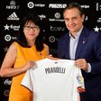 Cesare Prandelli (R) with Valencia's Singaporean President Lay Hoon Chan at the Mestalla stadium in Valencia on October 3, 2016