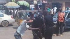 A man fighting with police officers (Illustration)