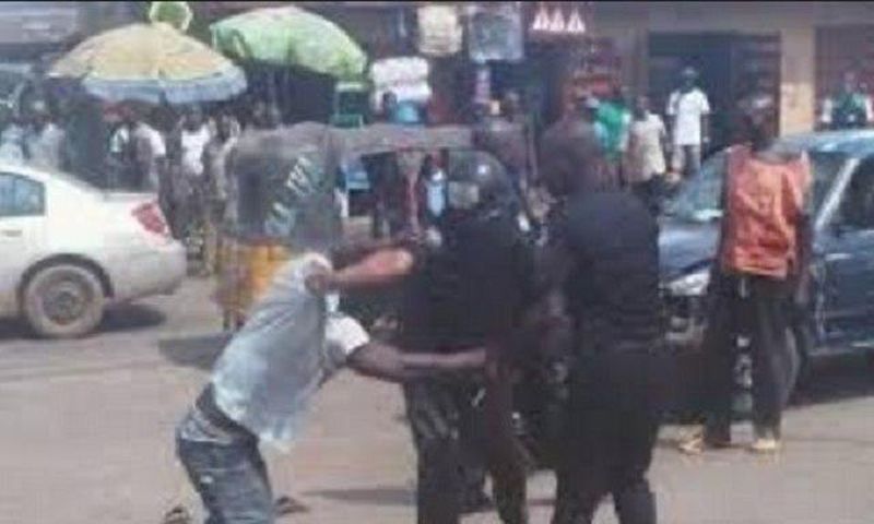 A man fighting with police officers (Illustration)