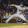 Clayton Kershaw of the Los Angeles Dodgers throws a pitch in the fifth inning against the Chicago Cubs at Wrigley Field on October 16, 2016 in Chicago, Illinois