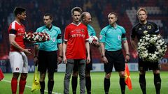 John Palmer (C), brother of Charlton Athletic season ticket holder, PC Keith Palmer, who was killed in the March 22, 2017 Westminster terror attack, greets match officials and players at The Valley Stadium in London