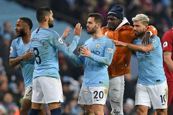 Manchester City's stars celebrate their vital victory over Liverpool