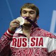 Russia's Apti Aukhadov, pictured on the podium of the men's 85kg weightlifting event at the 2012 Olympic Games, was stripped of his silver medal by the IOC after a sample re-test came back positive for drugs