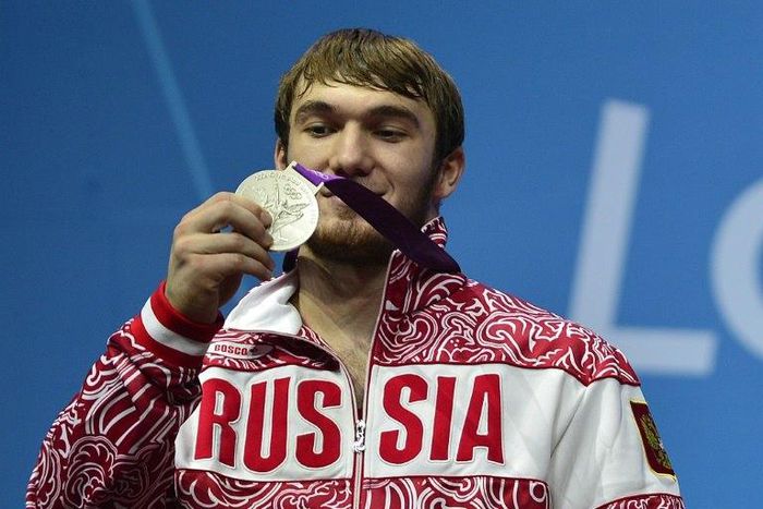 Russia's Apti Aukhadov, pictured on the podium of the men's 85kg weightlifting event at the 2012 Olympic Games, was stripped of his silver medal by the IOC after a sample re-test came back positive for drugs