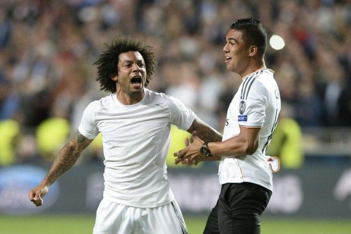 Real Madrid's Marcelo (L) and Carlos Henrique Casemiro will play in next month's highly-anticipated World Cup qualifying clash between old foes Brazil and Argentina