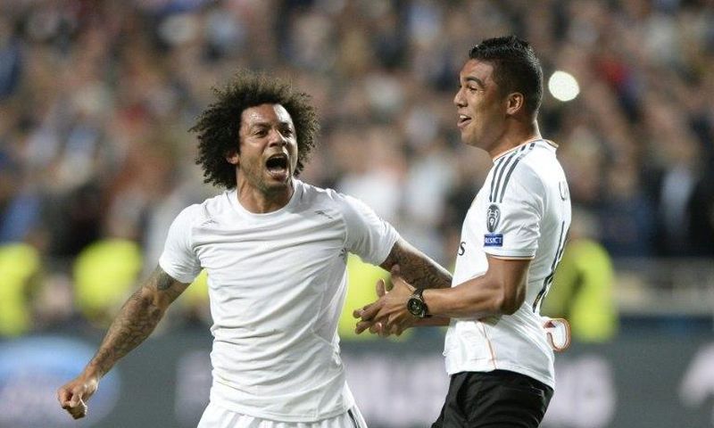Real Madrid's Marcelo (L) and Carlos Henrique Casemiro will play in next month's highly-anticipated World Cup qualifying clash between old foes Brazil and Argentina