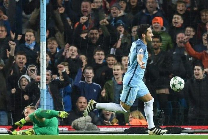 Manchester City's Ilkay Gundogan celebrates scoring his team's third goal during the match against Barcelona in Manchester on November 1, 2016