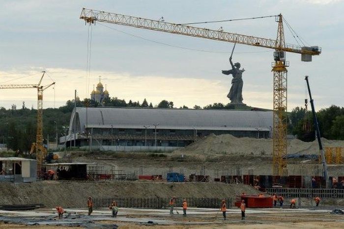 Construction site of the Arena Pobeda (Victory Stadium) football stadium in Volgograd, with the statue of Mother Homeland seen in the background
