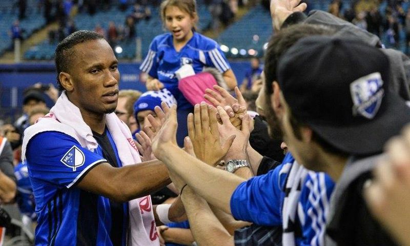 Didier Drogba of the Montreal Impact celebrates with fans during leg one of the MLS Eastern Conference finals against the Toronto FC at Olympic Stadium on November 22, 2016 in Montreal, Quebec, Canada