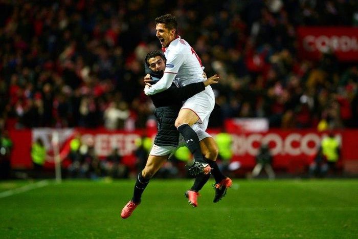 Sevilla's forward Stevan Jovetic (R) celebrates with Sevilla's forward Wissam Ben Yedder after scoring the 2-1 victory goal during the Spanish league football match Sevilla FC vs Real Madrid CF on January 15, 2017