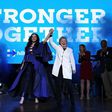 Hillary Clinton raises her arms with recording artist Katy Perry (L) during a get-out-the-vote concert at the Mann Center for the Performing Arts on November 5, 2016 in Philadelphia, Pennsylvania