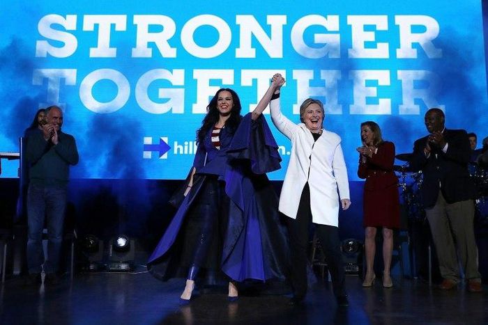 Hillary Clinton raises her arms with recording artist Katy Perry (L) during a get-out-the-vote concert at the Mann Center for the Performing Arts on November 5, 2016 in Philadelphia, Pennsylvania